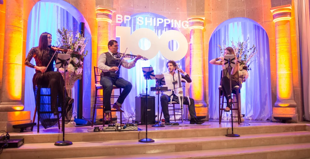 Electric string quartet performing on stage at an anniversary celebration at The Bell Tower on 34th, Houston, TX.
